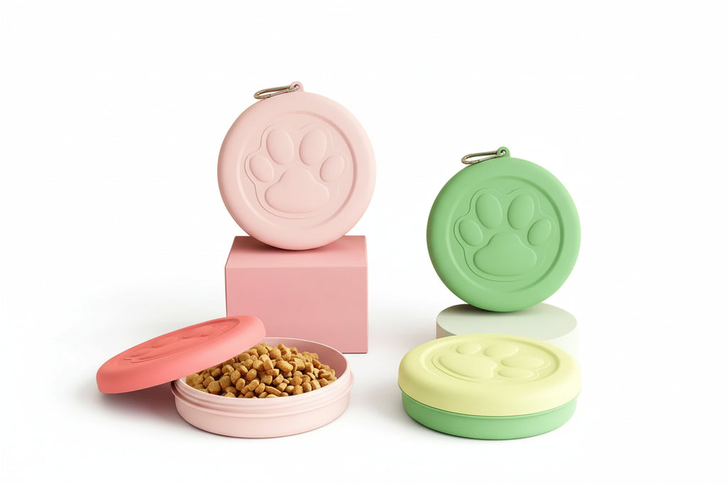 Set of colorful pet food containers with paw prints on lids, featuring pink, green, and yellow.