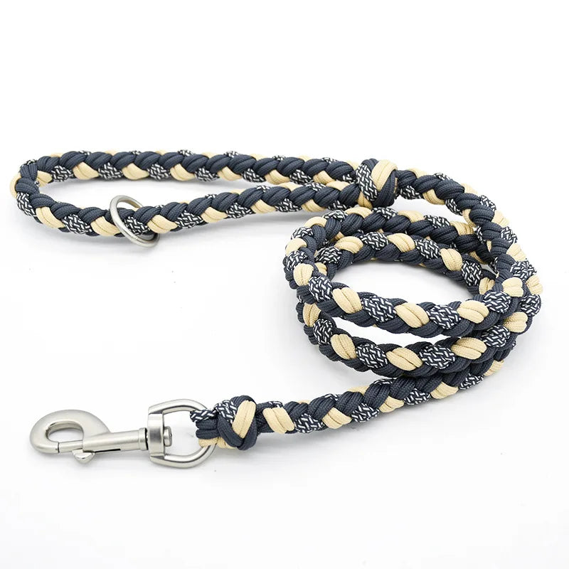 Navy and beige braided dog leash with metal clip on a white background