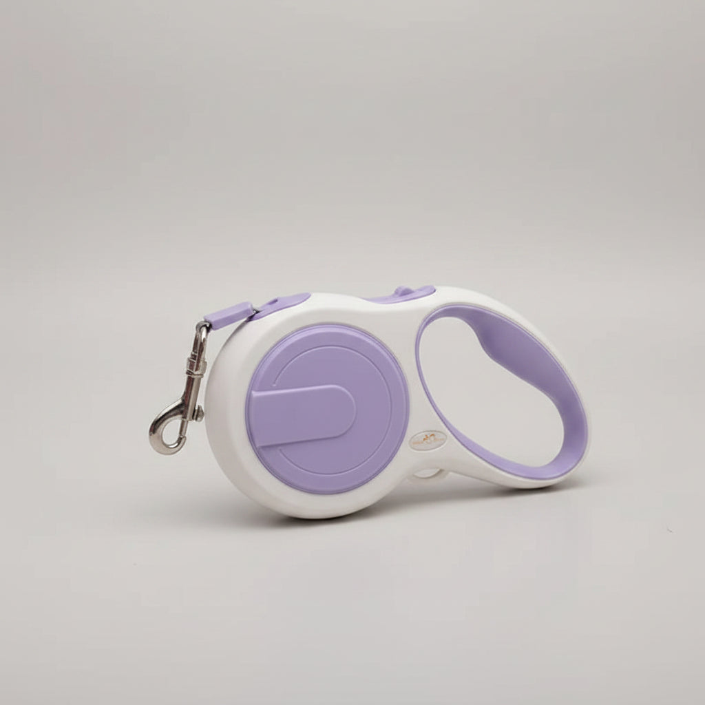 Retractable dog leash with purple handle and white body on a light background