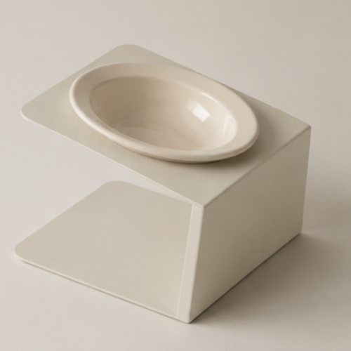 Minimalist ceramic bowl on a matching square pedestal against a plain background